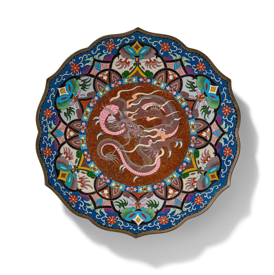 A Pair of Cloisonne-enamel Dishes Japan, Meiji era (1868-1912), late 19th century, (2): A Pair of Cloisonne-enamel Dishes Japan, Meiji era (1868-1912), late 19th century, Both with foliate rims and interior roundels containing dragons 12in (30.5cm) diam (2). For further information on