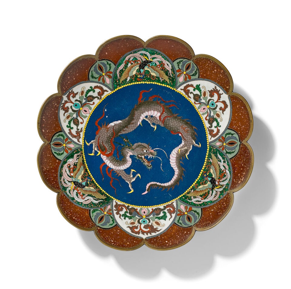 A Cloisonne-enamel Dish Japan, Meiji era (1868-1912), late 19th century,: A Cloisonne-enamel Dish Japan, Meiji era (1868-1912), late 19th century, With a petaled rim and decoration, the interior center with a dragon roundel 12in (30.5cm) diam For further information on this