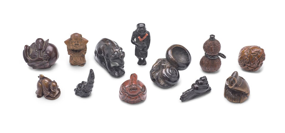 A Group of Twelve Mostly Wood Netsuke Japan, Edo period (1615-1868) or Meiji era (1868-1912), 19...: A Group of Twelve Mostly Wood Netsuke Japan, Edo period (1615-1868) or Meiji era (1868-1912), 19th century, A gourd and vine; a boar; a snail and basin; a nut as a Daruma, signed; a carved double-gour