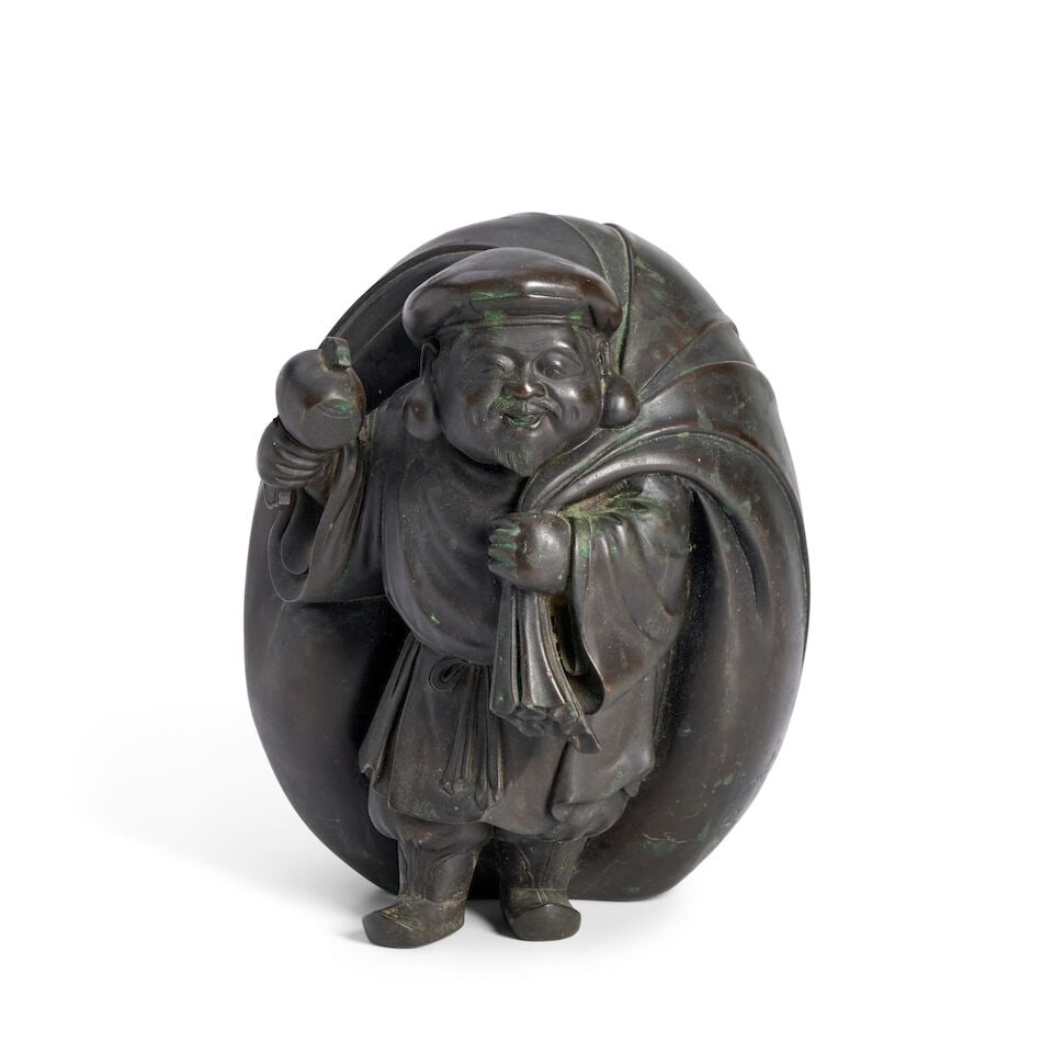 A Bronze Model of Daikoku Japan, Meiji (1868-1912) or Taisho (1912-1926) era, late 19th/early 20...: A Bronze Model of Daikoku Japan, Meiji (1868-1912) or Taisho (1912-1926) era, late 19th/early 20th century, Holding a mallet in one hand, the other holding an oversized sack which billows behind him,