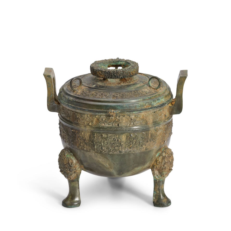 An Archaic Style Bronze Tripod Vessel and Cover, Ding China, Eastern Zhou style, 20th century, (1 of 2)