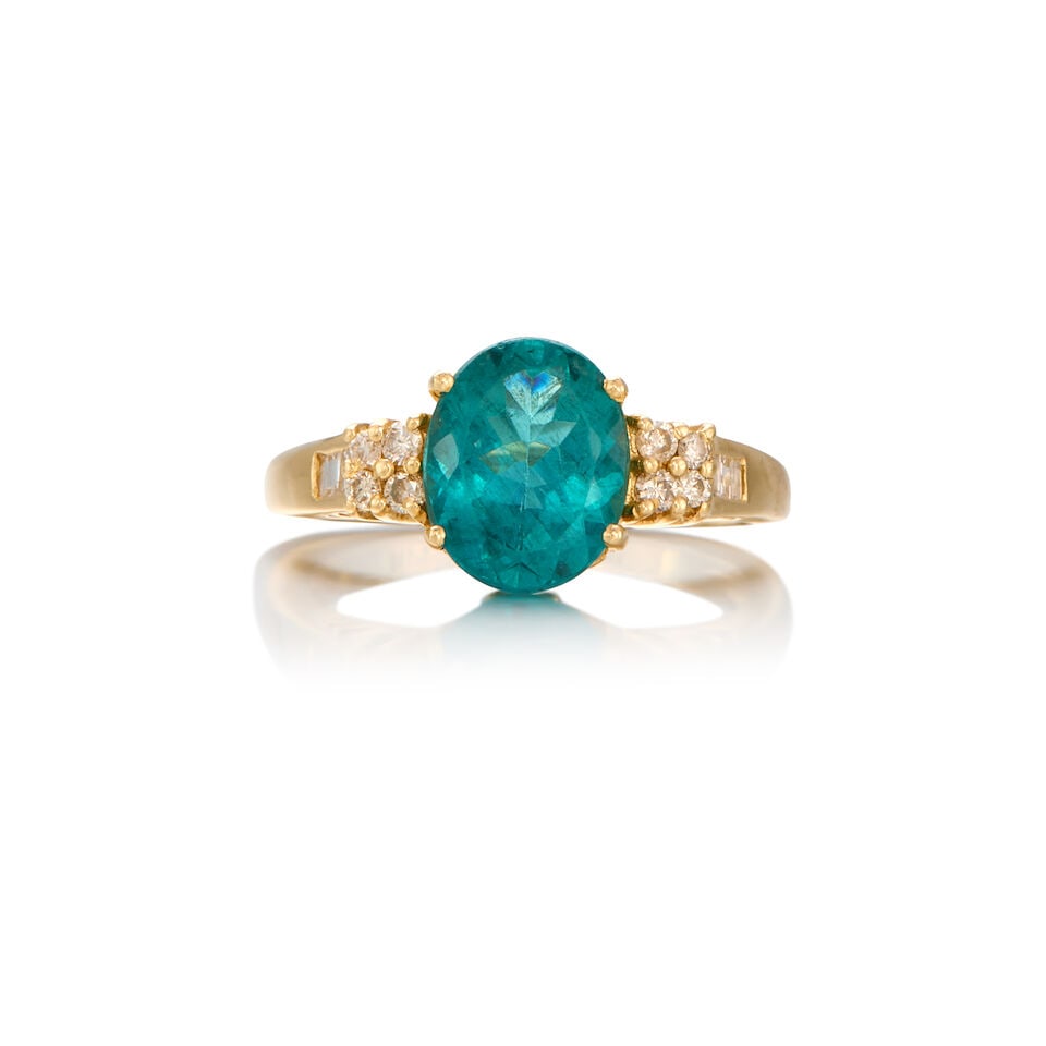 14K GOLD, APATITE AND DIAMOND RING: 14K GOLD, APATITE AND DIAMOND RING • One oval shaped apatite weighing approximately 2.10 carats total • Six baguette cut and eight round brilliant cut diamonds weighing approximately 0.18 