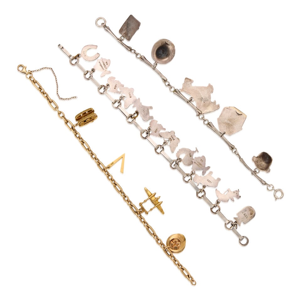 THREE SILVER AND GOLD CHARM BRACELETS - 2