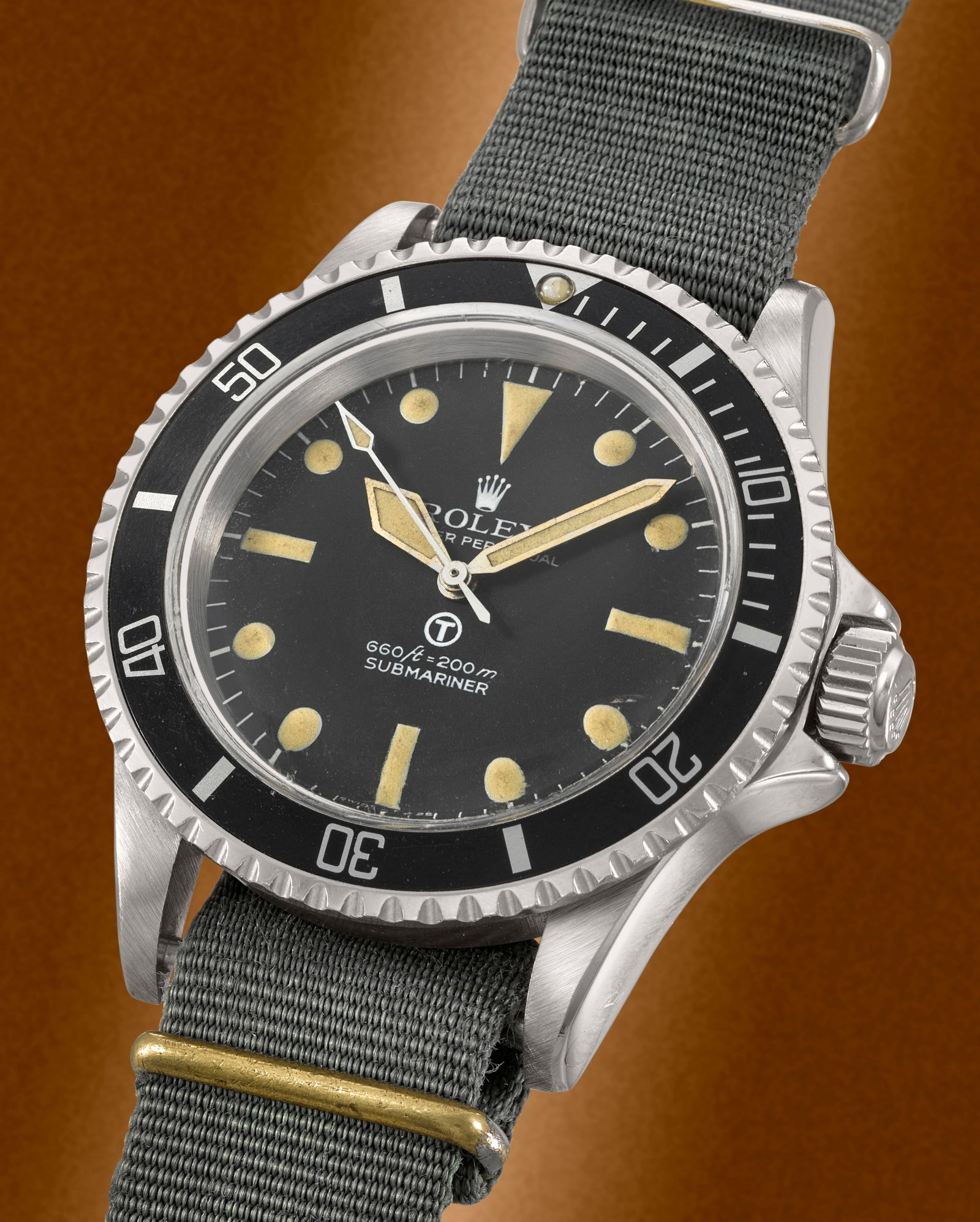 Rolex. A rare military stainless steel automatic wristwatch issued to the Royal Navy Military S...: Rolex. A rare military stainless steel automatic wristwatch issued to the Royal Navy Model: Military Submariner Reference: 5513 Date: Circa 1975 Movement: 26-jewel Cal.1520 automatic Dial: Black, Trit
