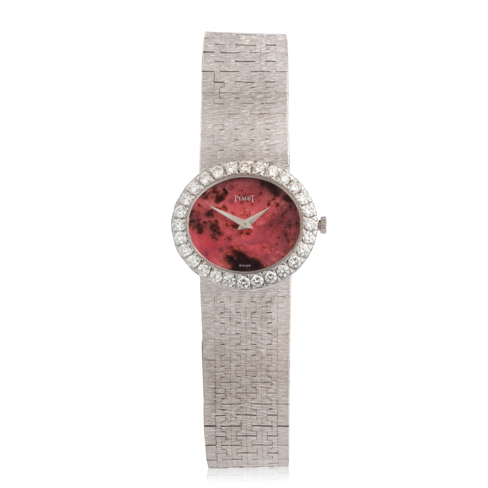 Piaget. A lady's 18K white gold diamond set manual wind bracelet watch with rhodonite dial Ref: ...: Piaget. A lady's 18K white gold diamond set manual wind bracelet watch with rhodonite dial Reference: 9804 A6 Date: Circa 1970 Movement: 18-jewel Cal.9P manual wind, No.681370 Dial: Rhodonite, polishe