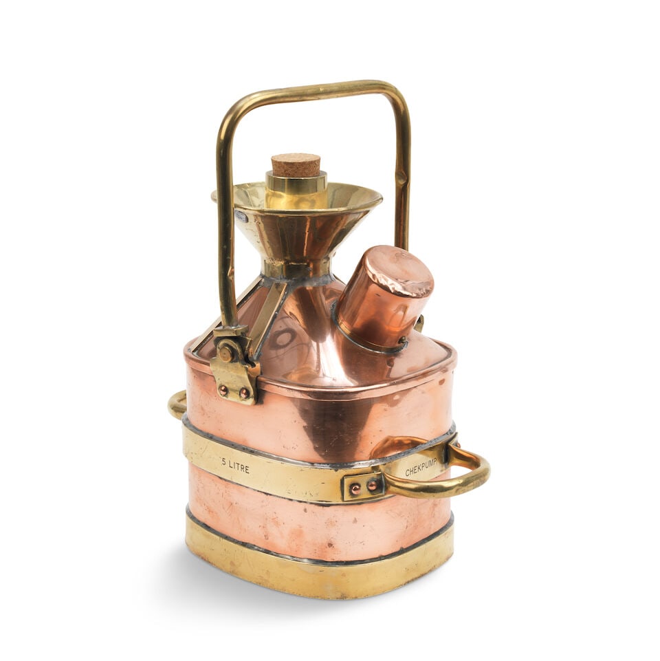 A Chekpump 5-Litre petrol measure for the 'City of Salford',: A Chekpump 5-Litre petrol measure for the 'City of Salford', polished brass and copper construction, 'square' body with rounded corners and sloped cone top, with replaced cork bung, with loop handle 3