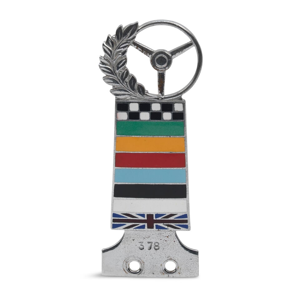 A Steering Wheel Club member's badge,: A Steering Wheel Club member's badge, number 378, chromed brass, enamelled in eight colours, 12.5cm high For further information on this lot please visit Bonhams.com For further information about this