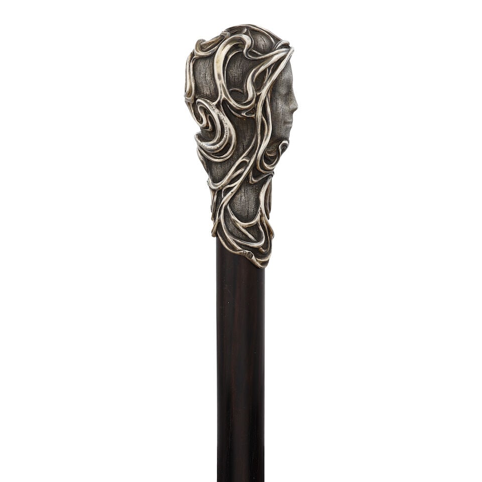 A BELGIAN ART NOUVEAU 800 STANDARD SILVER VEILED FACE CANELiege, dated 1902 - 2