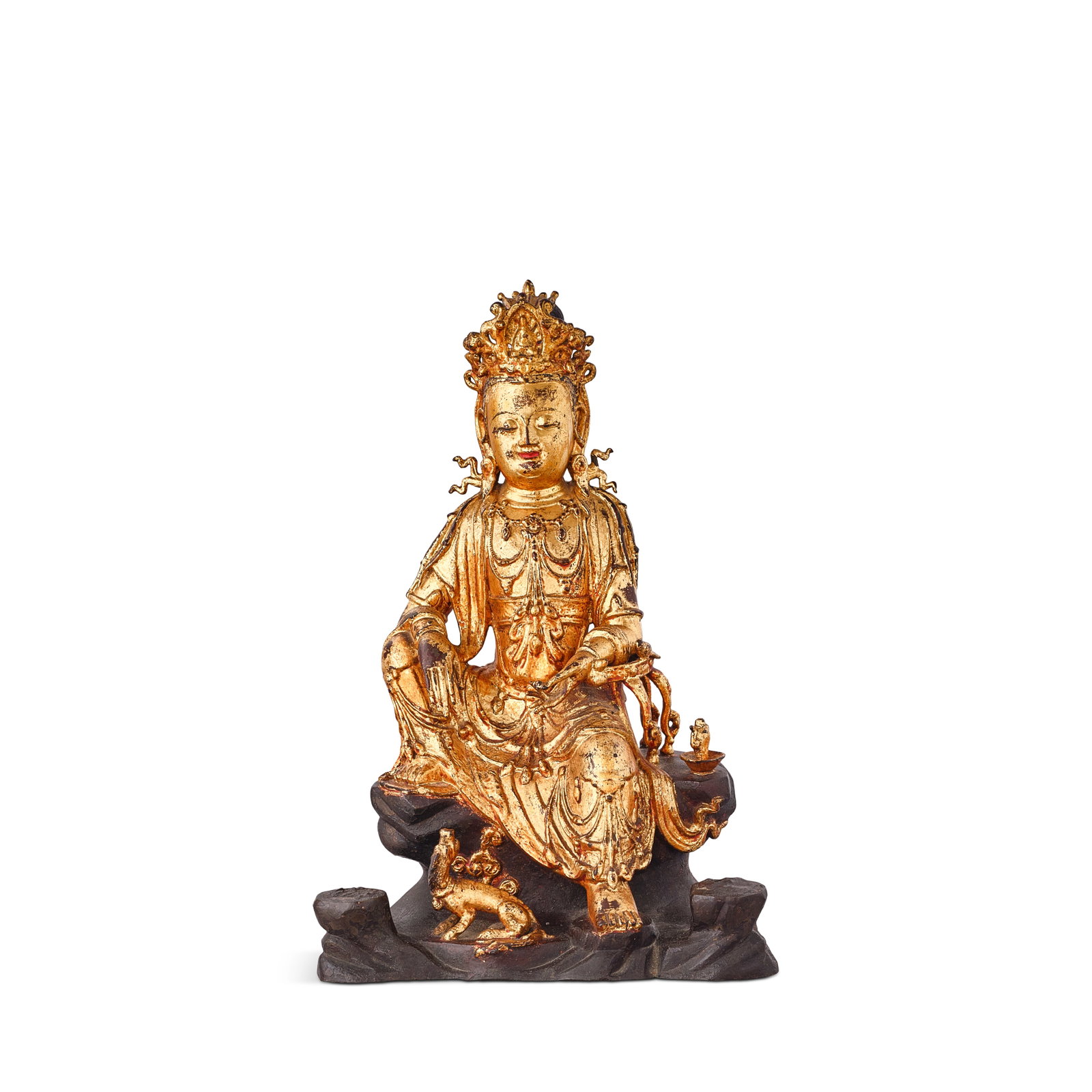 A LARGE LACQUER-GILT BRONZE FIGURE OF GUANYIN 17th century: A LARGE LACQUER-GILT BRONZE FIGURE OF GUANYIN 17th century Finely cast seated in lalitāsana, the right arm resting upon the raised knee and the left hand held at the side, the serene face flanked