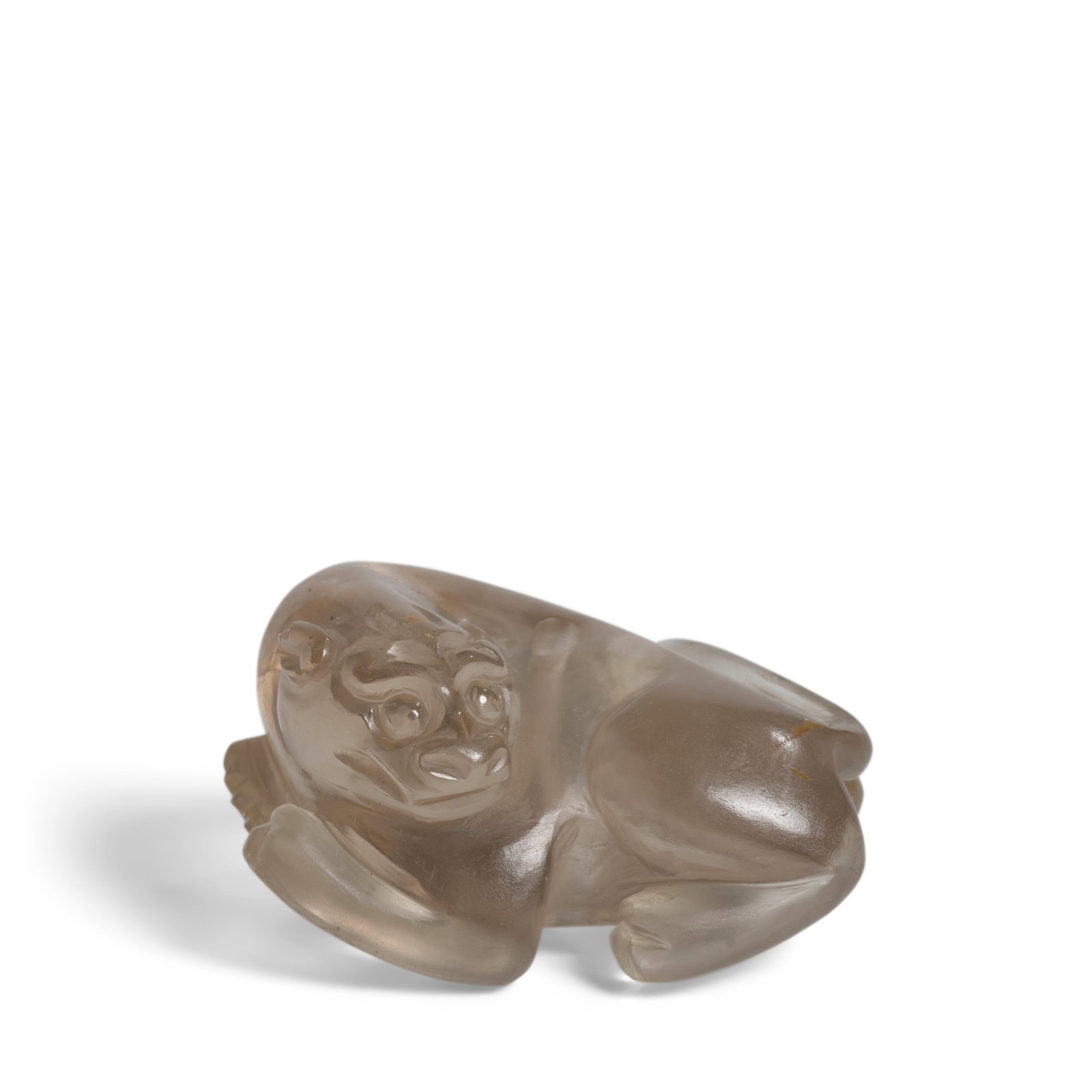 A ROCK CRYSTAL BIXIE PENDANT Song Dynasty or later: A ROCK CRYSTAL BIXIE PENDANT Song Dynasty or later Finely worked with its head sharply turned to the left, the recumbent mythical beast with gentle eyes and curling eyebrows, its feet detailed with fi