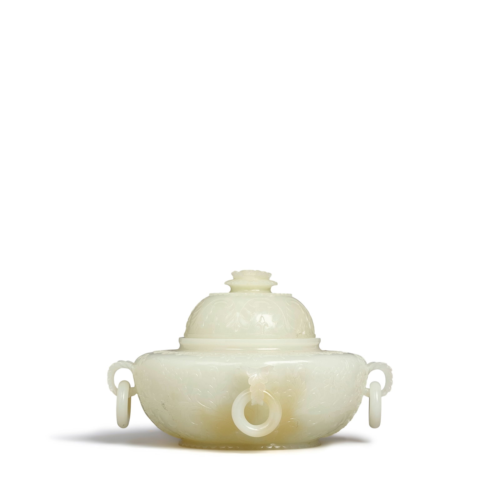 A WHITE JADE MUGHAL-STYLE CENSER AND COVER 20th century: A WHITE JADE MUGHAL-STYLE CENSER AND COVER 20th century Of compressed ovoid form supported on slightly raised foot, the body carved in low relief with stylized foliate scrolls and floral blossoms, the