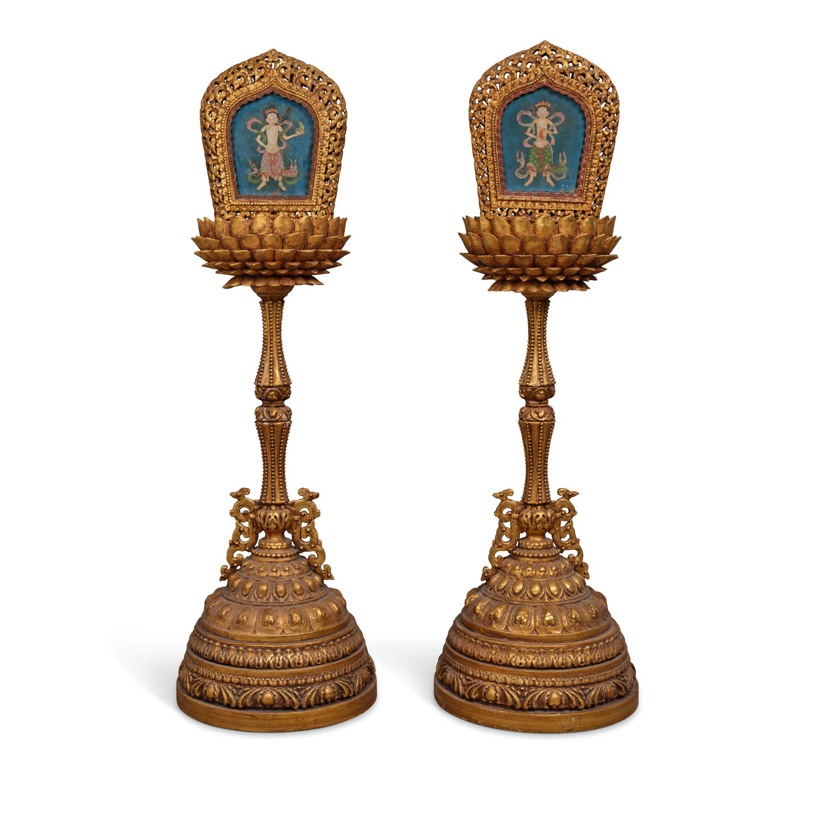 A PAIR OF LARGE GILT-LACQUERED CARVED WOOD LOTUS ALTAR STANDS 18th/19th century (3): A PAIR OF LARGE GILT-LACQUERED CARVED WOOD LOTUS ALTAR STANDS 18th/19th century Each finely carved with a tiered domed base decorated with concentric bands of lotus petals and foliate motifs, supporti