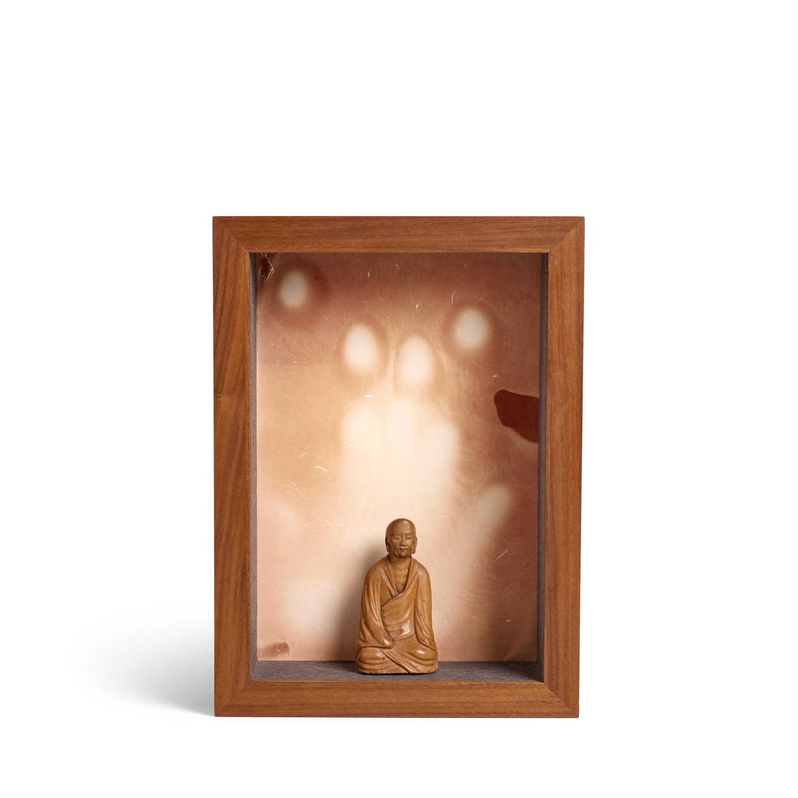 A BOXWOOD CARVING OF A SEATED MONK AND 'PALM PRINT' PHOTO FRAME Monk: late 18th/early 19th centu... (1 of 1)