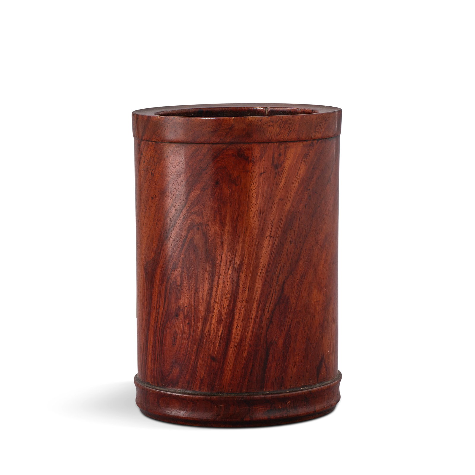 A SMALL HUANGHUALI BRUSHPOT, BITONG 18th century: A SMALL HUANGHUALI BRUSHPOT, BITONG 18th century The well-figured tall cylinder decorated with a grooved band near the base, the mouth rim decorated with a collared and grooved top, the base inset sep
