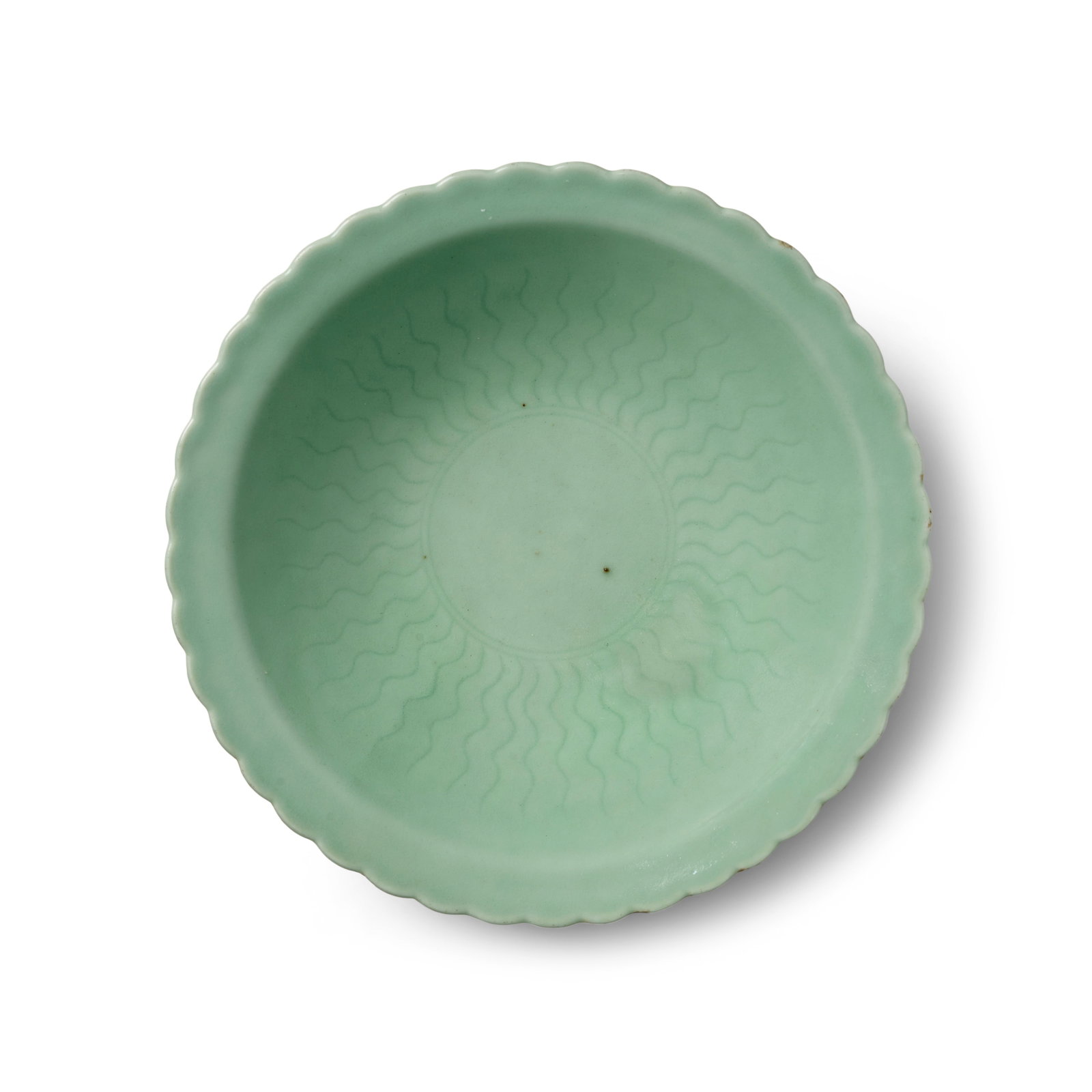A CELADON-GLAZED FLORAL BOWL Qianlong six-character seal mark and of the period: A CELADON-GLAZED FLORAL BOWL Qianlong six-character seal mark and of the period Of conical form with everted petal rim, the interior finely incised with radiating undulating lines issuing from the cen