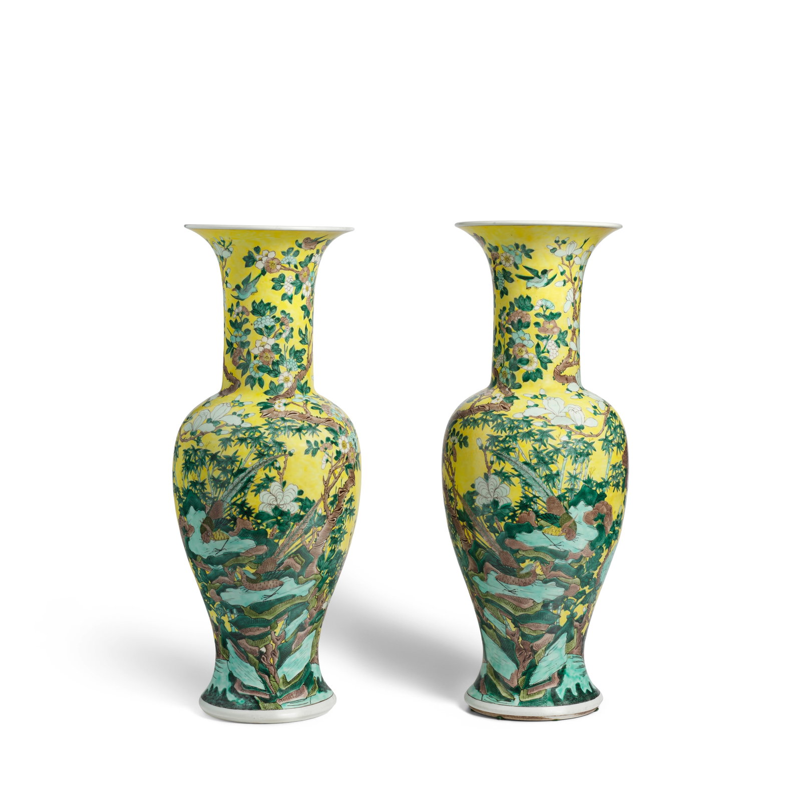 TWO FAMILLE-JAUNE 'BIRDS AND FLOWERS' YENYEN VASES Kangxi period bodies, 18th/19th century later...: TWO FAMILLE-JAUNE 'BIRDS AND FLOWERS' YENYEN VASES Kangxi period bodies, 18th/19th century later enamels Each modelled with a baluster body and tall flaring trumpet neck, brightly enameled against a y