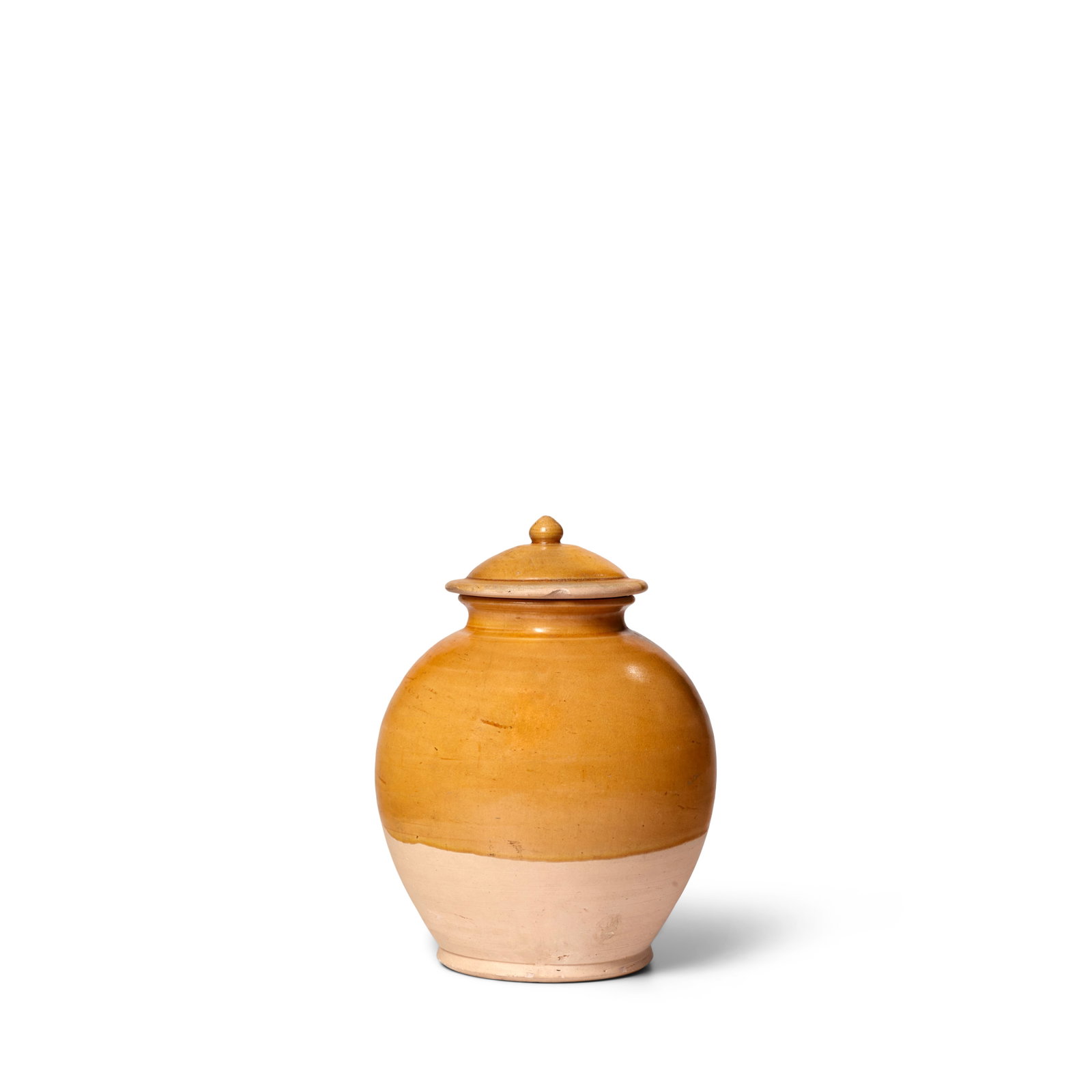 A YELLOW-GLAZED POTTERY JAR AND COVER Tang Dynasty (1 of 1)