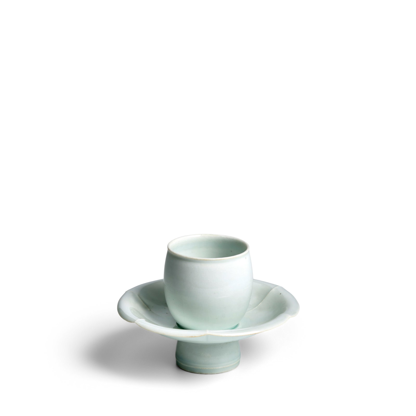 A QINGBAI-GLAZED CUPSTAND WITH PETAL-LOBED RIM Song Dynasty (brocade box) (1 of 1)