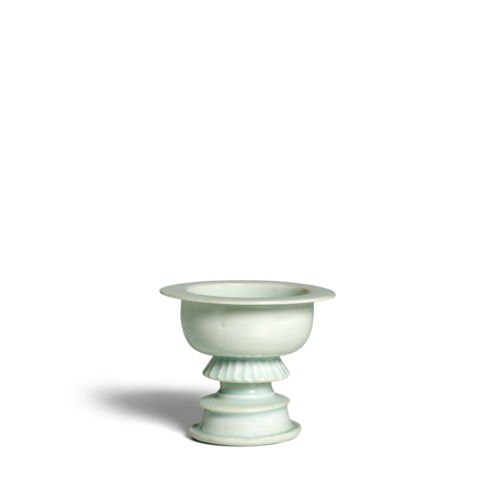 A QINGBAI-GLAZED FOOTED CENSER Northern Song Dynasty: A QINGBAI-GLAZED FOOTED CENSER Northern Song Dynasty The deep spherical bowl with straight sides and flat everted rim resting on a ribbed apron and stepped foot, covered inside and out with a transluc
