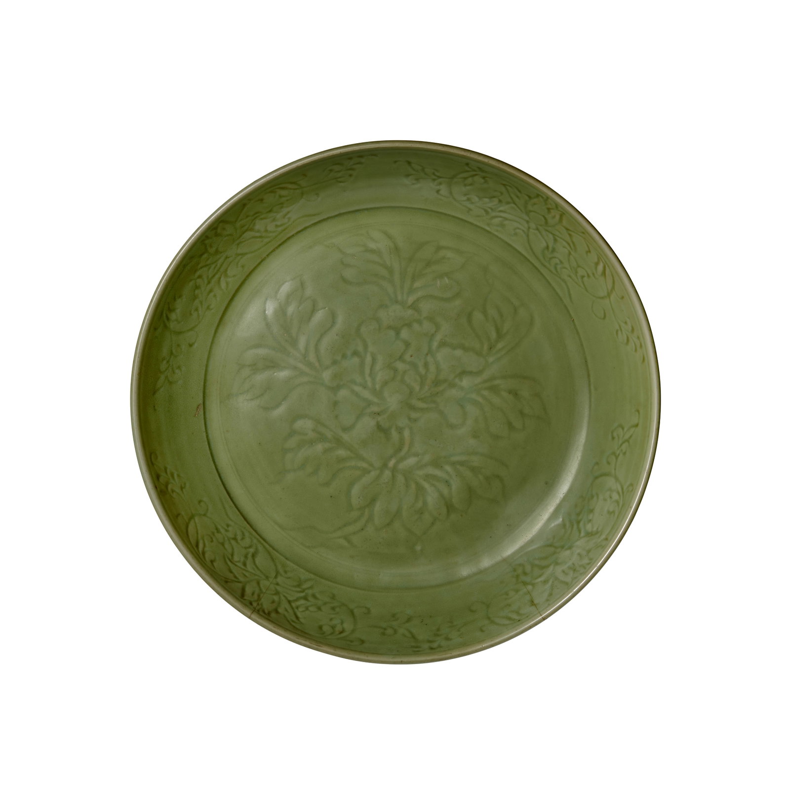 A LARGE LONGQUAN CELADON 'PEONY' CHARGER Early Ming Dynasty, 15th century: A LARGE LONGQUAN CELADON 'PEONY' CHARGER Early Ming Dynasty, 15th century Heavily potted with deep rounded sides and rolled lip, the center medallion freely carved with a single spray of blossoming pe