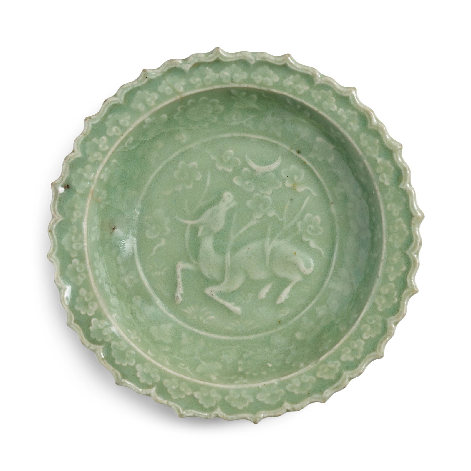 A MOLDED LONGQUAN CELADON BARBED-RIM 'XINIU' DISH Yuan Dynasty (1 of 1)