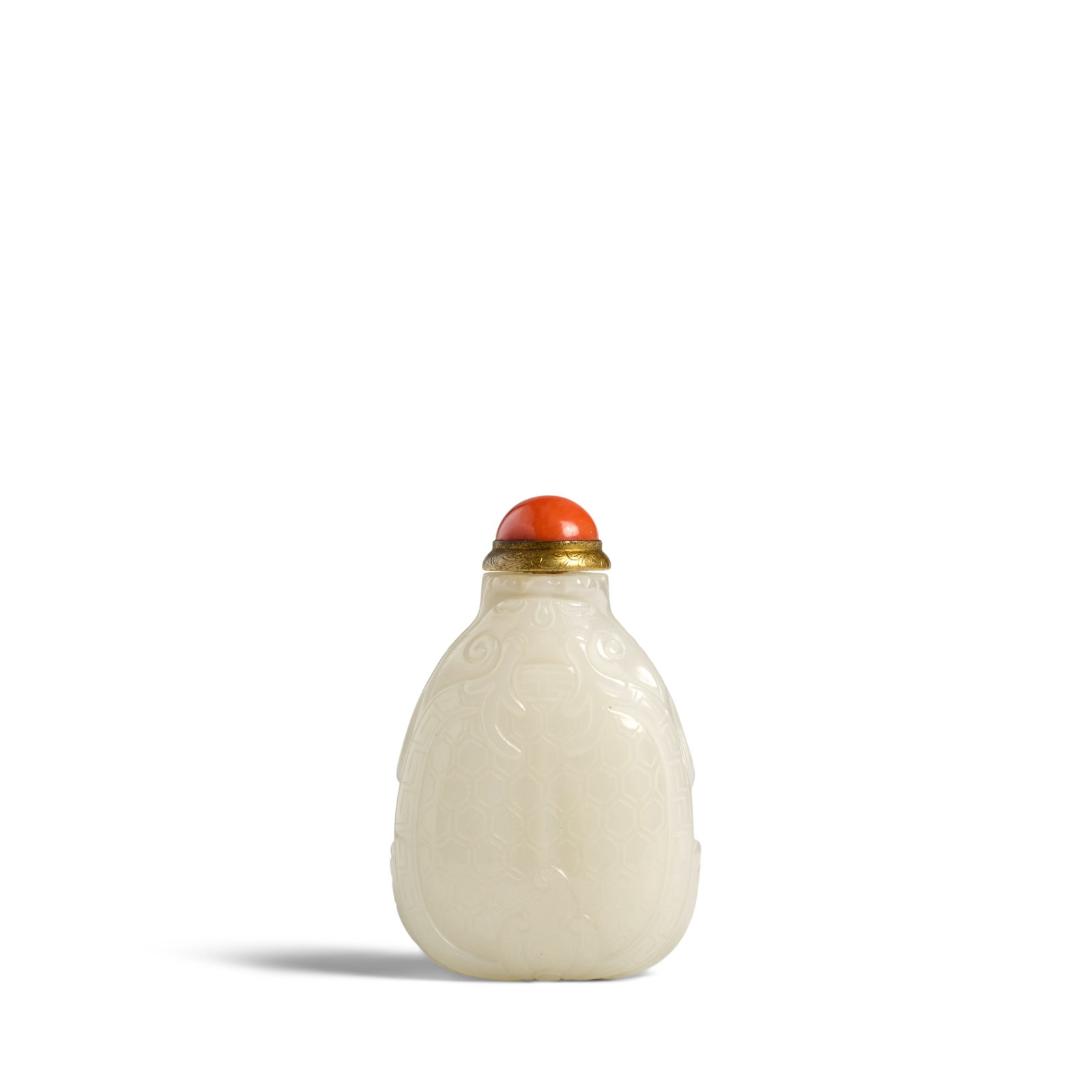 A RARE WHITE JADE 'MYTHICAL TORTOISE' SNUFF BOTTLE 1780-1850: A RARE WHITE JADE 'MYTHICAL TORTOISE' SNUFF BOTTLE 1780-1850 The icy white spade-shaped bottle finely carved as a mythical tortoise, the hexagonal-patterned carapace supporting paired horns, the eyes,