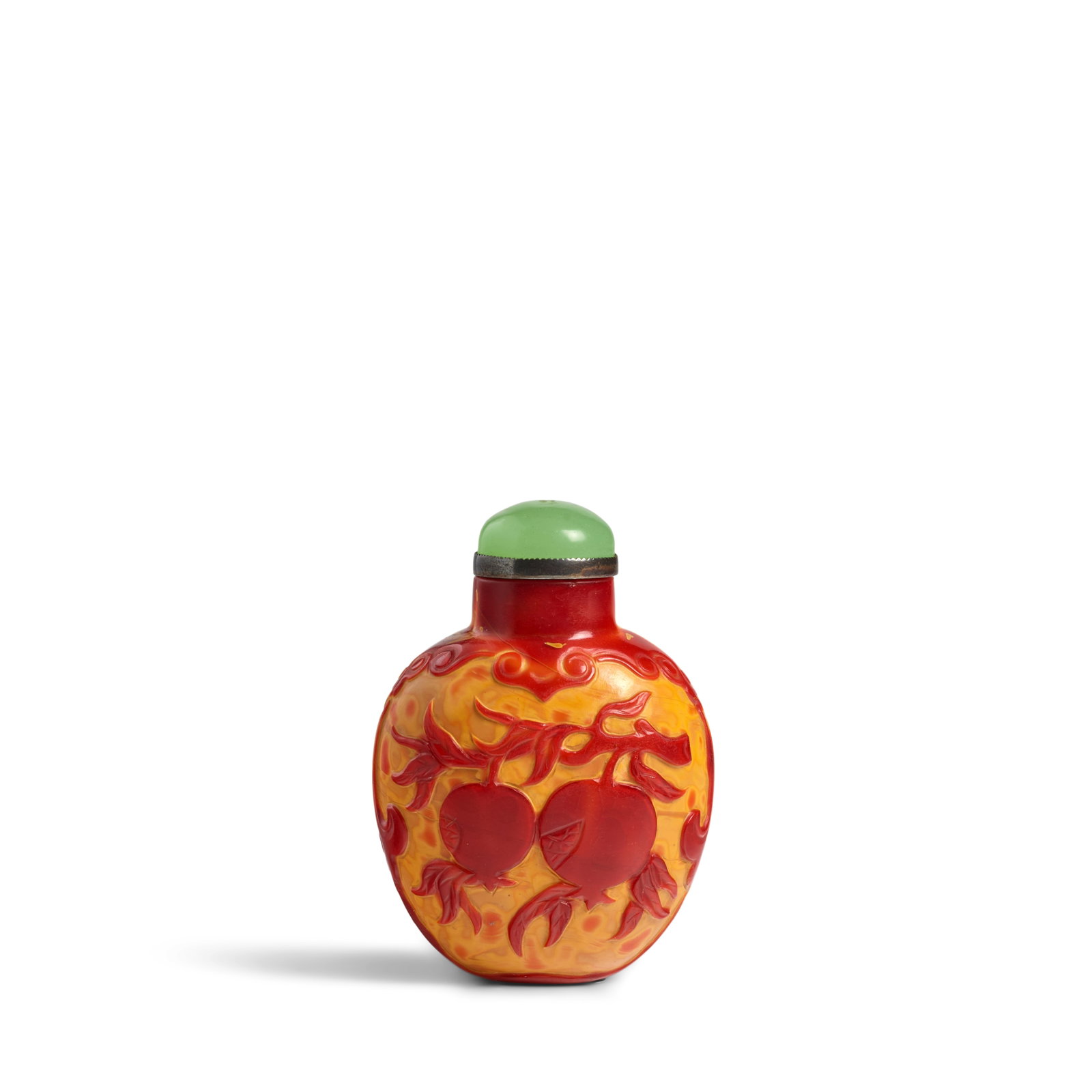 A CARVED 'REALGAR' GLASS 'MELON AND POMEGRANATE' SNUFF BOTTLE 1820-1880: A CARVED 'REALGAR' GLASS 'MELON AND POMEGRANATE' SNUFF BOTTLE 1820-1880 Of rounded bulbous shape, the pale 'orange-peel' surface cut away leaving a brilliant orange-red 'skin' of leafy vines suspendin