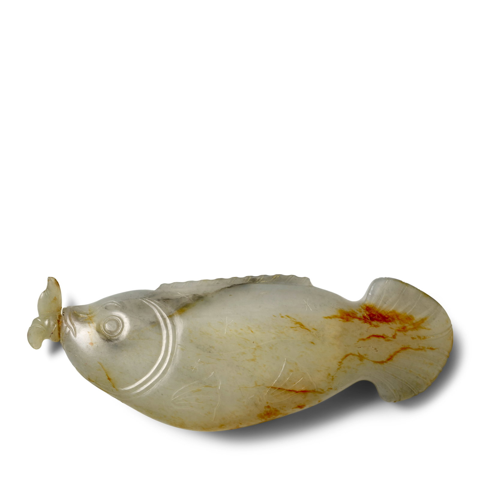 A CARVED JADE 'CARP' SNUFF BOTTLE 19th century: A CARVED JADE 'CARP' SNUFF BOTTLE 19th century Naturalistically carved as a swimming carp with flared tail fin in action, small fins tucked into its body and head well-delineated, the greyish white st