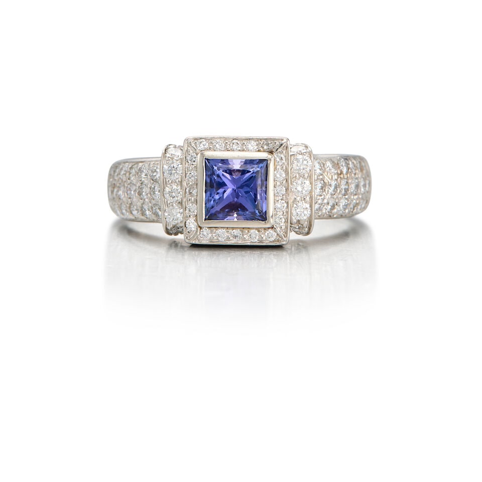 PLATINUM, TANZANITE AND DIAMOND RING: PLATINUM, TANZANITE AND DIAMOND RING • One square-shaped tanzanite weighing approximately 0.81 carat • Numerous round brilliant-cut diamonds weighing approximately 1.22 carats total