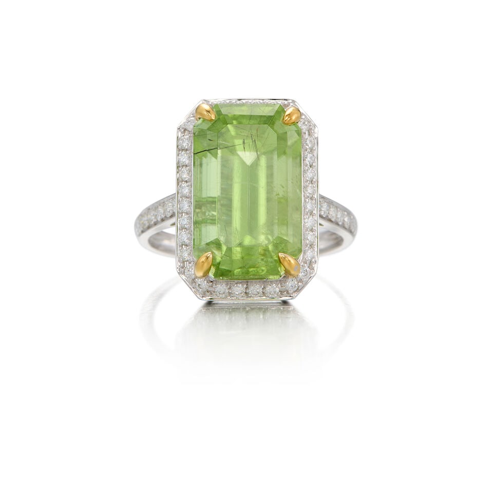A PLATINUM, PERIDOT AND DIAMOND RING: A PLATINUM, PERIDOT AND DIAMOND RING • One emerald-shaped peridot weighing approximately 9.88 carats total • Numerous round-shaped diamonds weighing approximately 0.37 carat total • 