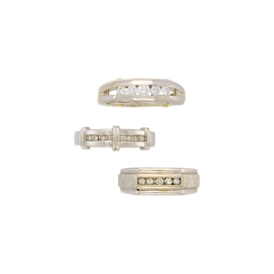THREE 14K WHITE GOLD AND DIAMOND RINGS: THREE 14K WHITE GOLD AND DIAMOND RINGS • A 14K white gold ring with five round shaped diamonds weighing approximately 0.55 carat total, size 10 3/4 • A 14K white gold ring with eight