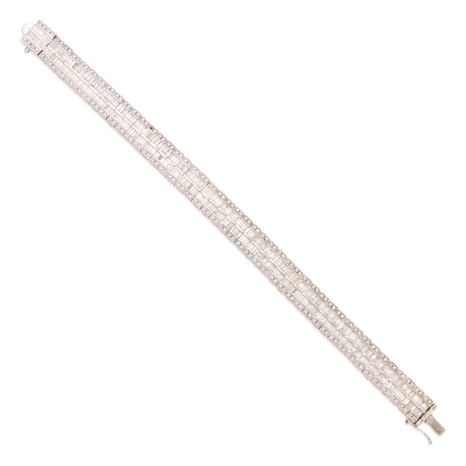18K WHITE GOLD AND DIAMOND BRACELET: 18K WHITE GOLD AND DIAMOND BRACELET • Numerous baguette and tapered baguette diamonds weighing approximately 3.22 carats total • Numerous round brilliant-cut diamonds weighing