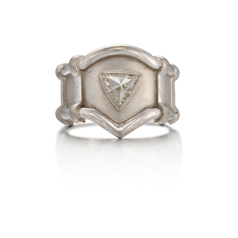 17K WHITE GOLD AND DIAMOND RING: 17K WHITE GOLD AND DIAMOND RING • One triangle shaped diamond weighing approximately 0.29 carat total • With maker's mark • Size 8 1/8 • Estimated gross weight: 13.20