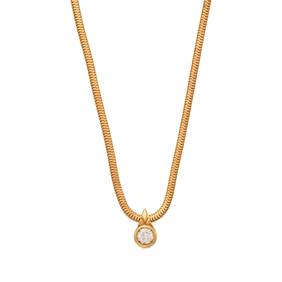 18K GOLD AND DIAMOND NECKLACE: 18K GOLD AND DIAMOND NECKLACE • One round brilliant-cut diamond weighing approximately 0.50 carat total • Scratch mark present • Pendant measures 7/16 in. x 1/4 in. and chain length