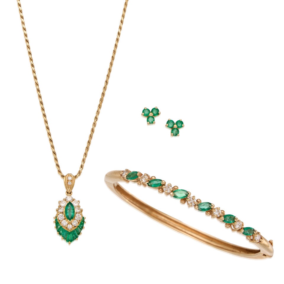 A GROUP OF GOLD, EMERALD AND DIAMOND JEWELRY: A GROUP OF GOLD, EMERALD AND DIAMOND JEWELRY • An 18K gold pendant with one marquise-shaped emerald measuring approximately 7.12mm x 3.57mm x dept isn't available due to setting, seven tapered