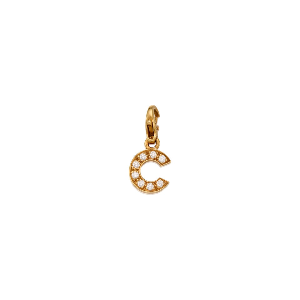 CHANEL: 18K GOLD AND DIAMOND CHARM: CHANEL: 18K GOLD AND DIAMOND CHARM • Eight round brilliant-cut diamonds weighing approximately 0.16 carat total • Stamped CHANEL • With maker's mark, French eagle hallmark, and