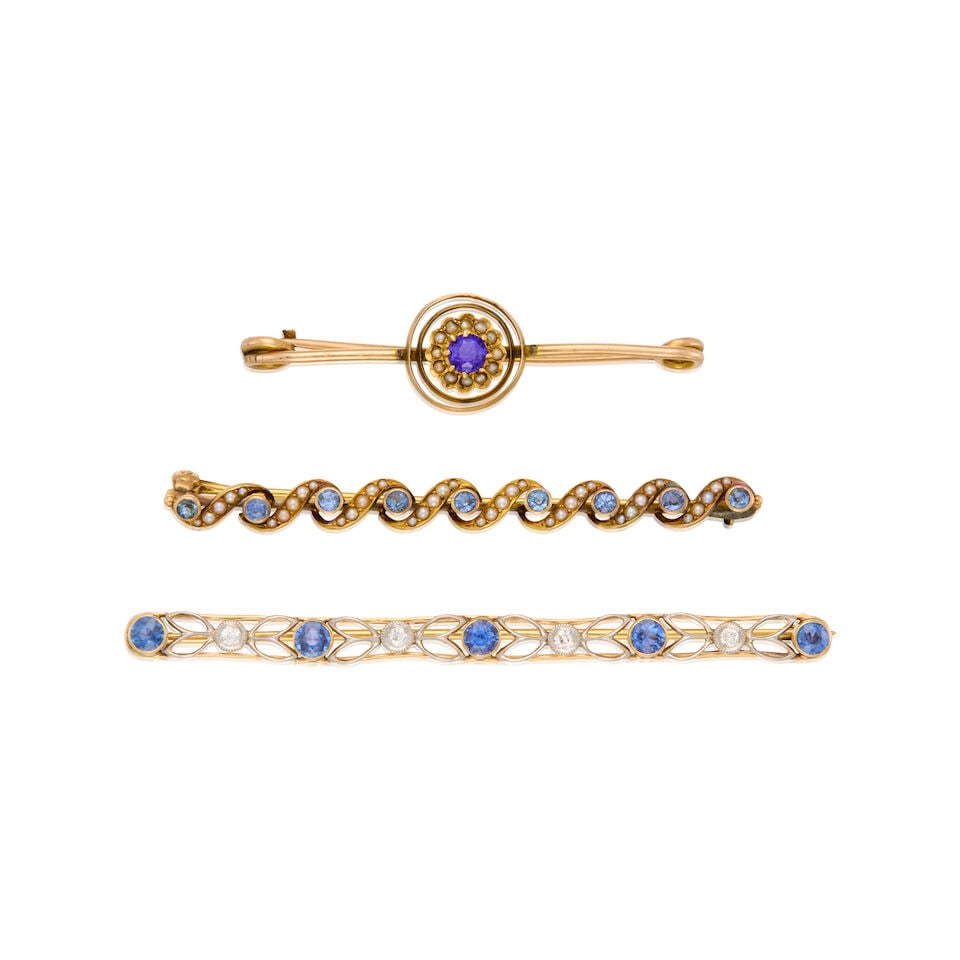 A GROUP OF ANTIQUE BROOCHES: A GROUP OF ANTIQUE BROOCHES • A 10K gold brooch with one round-shaped glass doublet measuring approximately 3.95mm in diameter, twelve cultured seed pearls and scratch mark, measures 1 7/8 in.