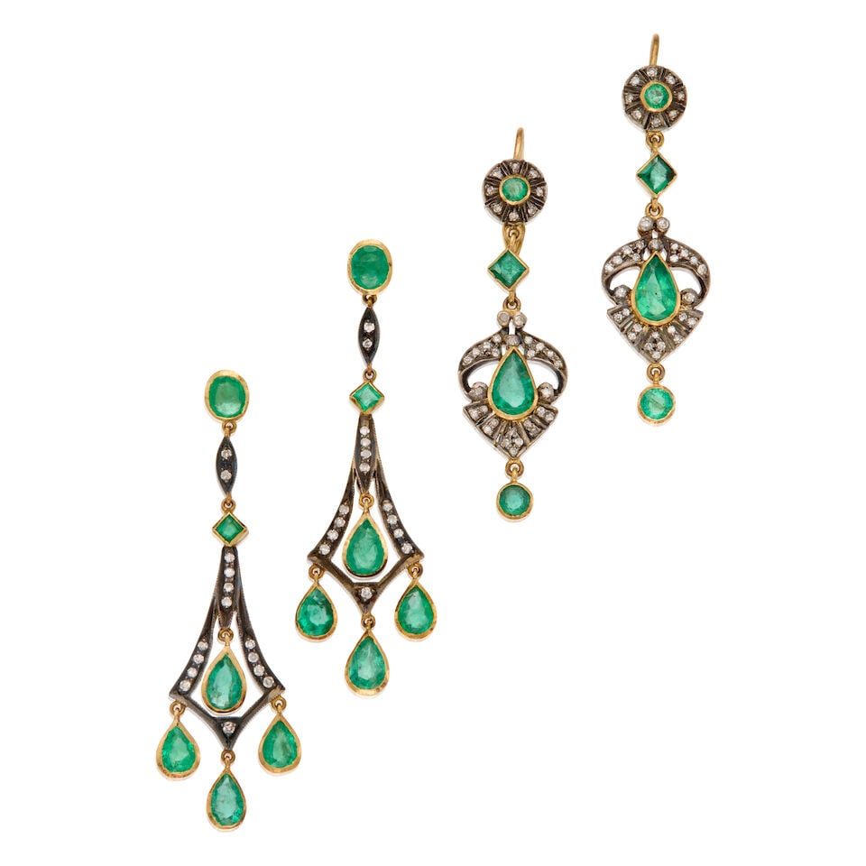 TWO PAIRS OF EMERALD AND DIAMOND DROP EARRINGS: TWO PAIRS OF EMERALD AND DIAMOND DROP EARRINGS • A pair of 12K and silver earrings with four rounds, two squares and two pear-shaped emeralds weighing approximately 1.04 carats total, numerous