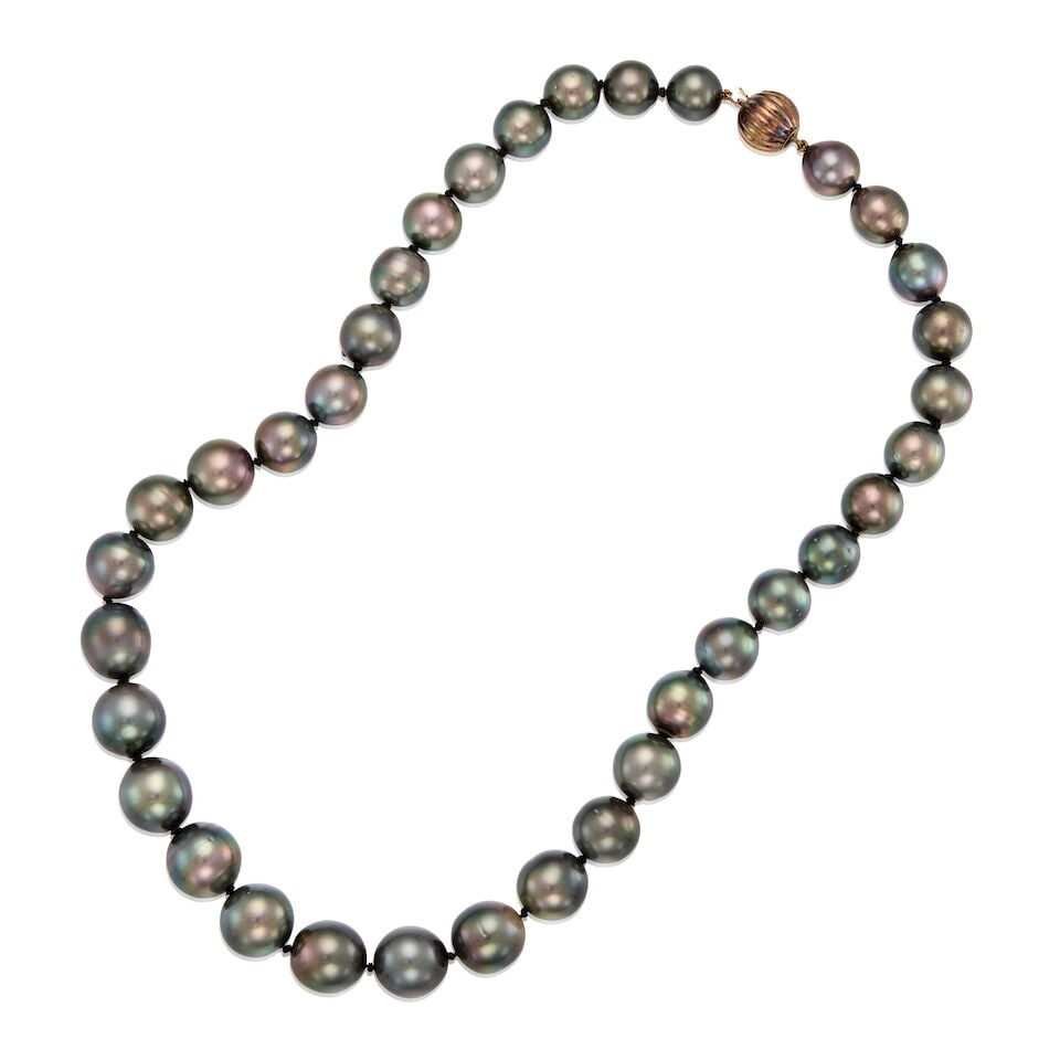 A GOLD AND CULTURED PEARL NECKLACE: A GOLD AND CULTURED PEARL NECKLACE • 14K and 19K gold clasp • Thirty-five round drilled cultured pearl measuring approximately 10.99mm to 13.37mm in diameter • Length 19 1/4