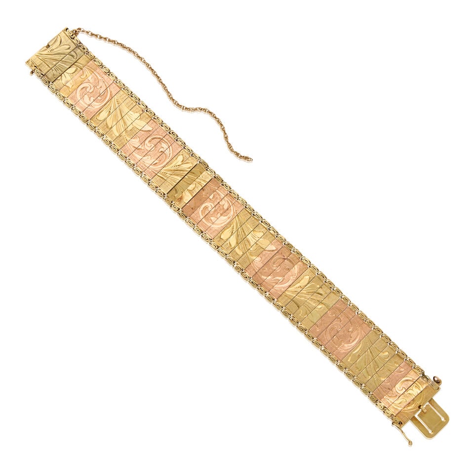 A BICOLORED 14K GOLD BRACELET: A BICOLORED 14K GOLD BRACELET • 14K yellow and rose gold bracelet with safety chain • Maker's mark and assay mark present • Length 7 in. • Estimated gross weight: 21.0