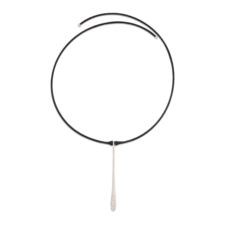 18K WHITE GOLD AND DIAMOND CHOKER NECKLACE: 18K WHITE GOLD AND DIAMOND CHOKER NECKLACE • An 18K white gold and black fabric necklace with numerous round-shaped diamonds weighing approximately 0.54 carat total • Wearable length 15.5
