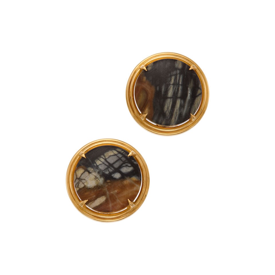 18K GOLD AND CHALCEDONY CLIP EARRINGS: 18K GOLD AND CHALCEDONY CLIP EARRINGS • Two round cabochon-shaped chalcedonies measuring approximately 20.04mm x 20.06mm x 5.63mm • Measures 1 in. x 1 in. • Estimated gross weight: