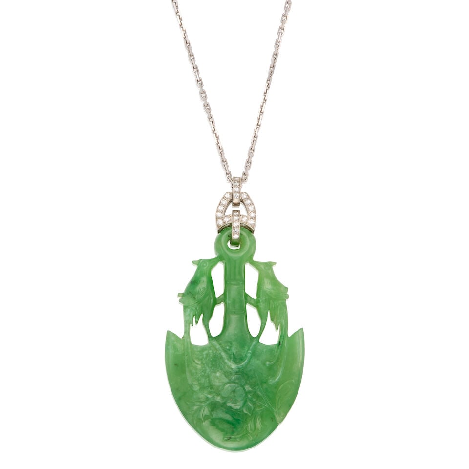 JADE AND DIAMOND PENDANT WITH CHIAN: JADE AND DIAMOND PENDANT WITH CHIAN • A platinum pendant with one carved jade measuring approximately 51.90mm x 32.60mm x 7.78mm and twenty-one round single-cut diamonds weighing approximately