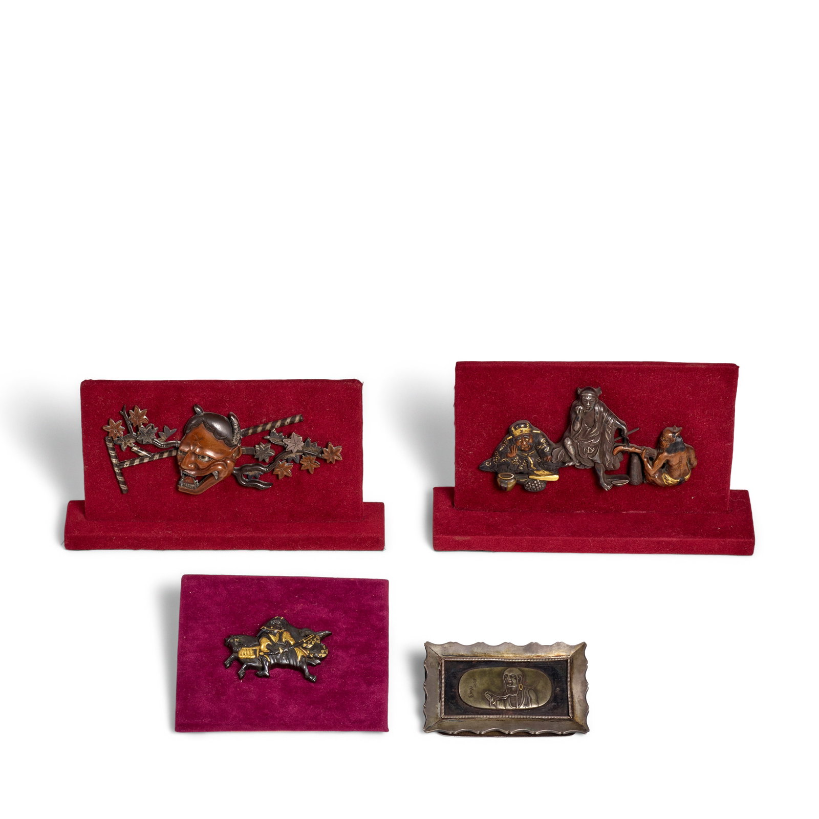 FOUR MIXED-METAL KANAMONO (POUCH CLASPS) Edo period (1615-1868) or Meiji era (1868-1912), 19th c...: FOUR MIXED-METAL KANAMONO (POUCH CLASPS) Edo period (1615-1868) or Meiji era (1868-1912), 19th century The first chiseled in the round in gold, silver, copper, and shakudō with the Hell Judge Enm