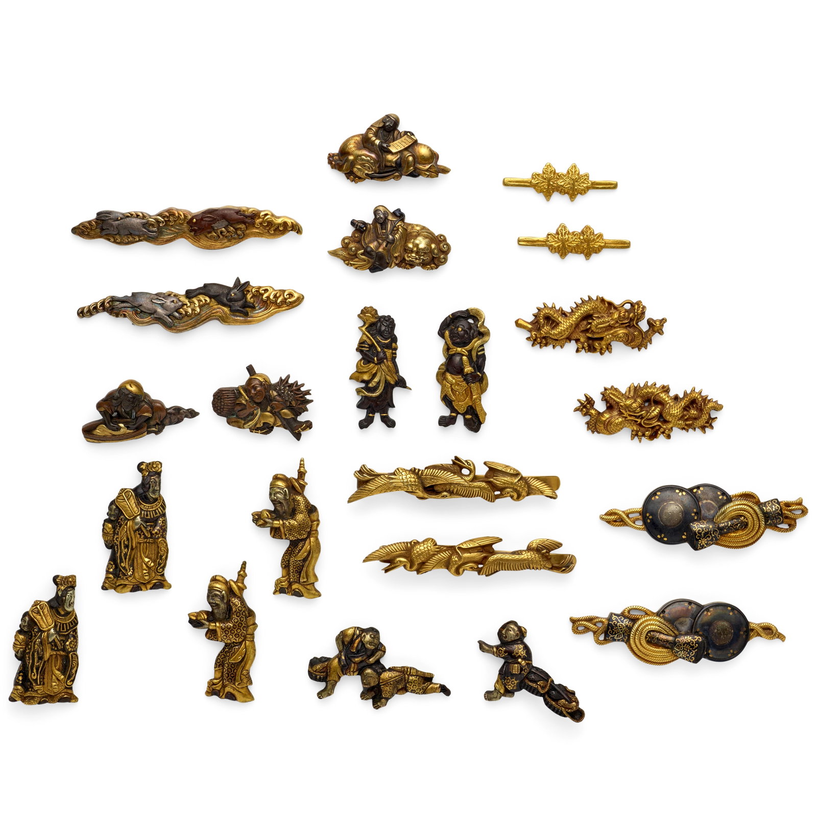 NINE PAIRS AND A DAISHŌ SET OF MENUKI (HILT GRIPS) Edo period (1615-1868), 18th/19th centur...: NINE PAIRS AND A DAISHŌ SET OF MENUKI (HILT GRIPS) Edo period (1615-1868), 18th/19th century Comprising a Yanagawa-school pair in gold, silver, and shibuichi formed as Fugen and Monju Bosatsu; a 