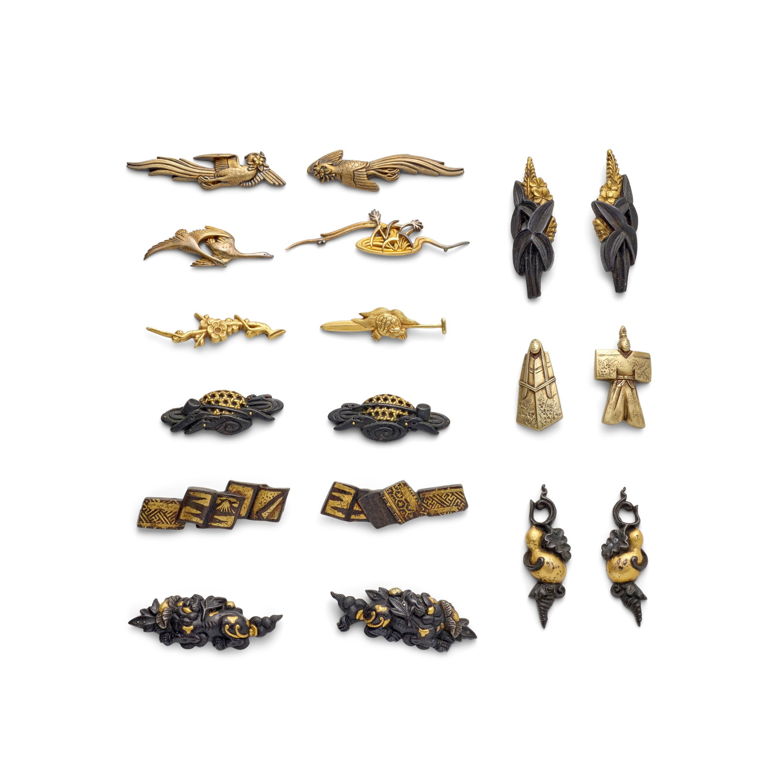 SEVEN PAIRS OF MIXED-METAL MENUKI (HILT GRIPS) AND FOUR SINGLE MIXED-METAL MENUKI Edo period (1...: SEVEN PAIRS OF MIXED-METAL MENUKI (HILT GRIPS) AND FOUR SINGLE MIXED-METAL MENUKI Edo period (1615-1868), 18th/19th century Comprising a gilt-metalpair in the form of tachibina dolls; a shakudō a
