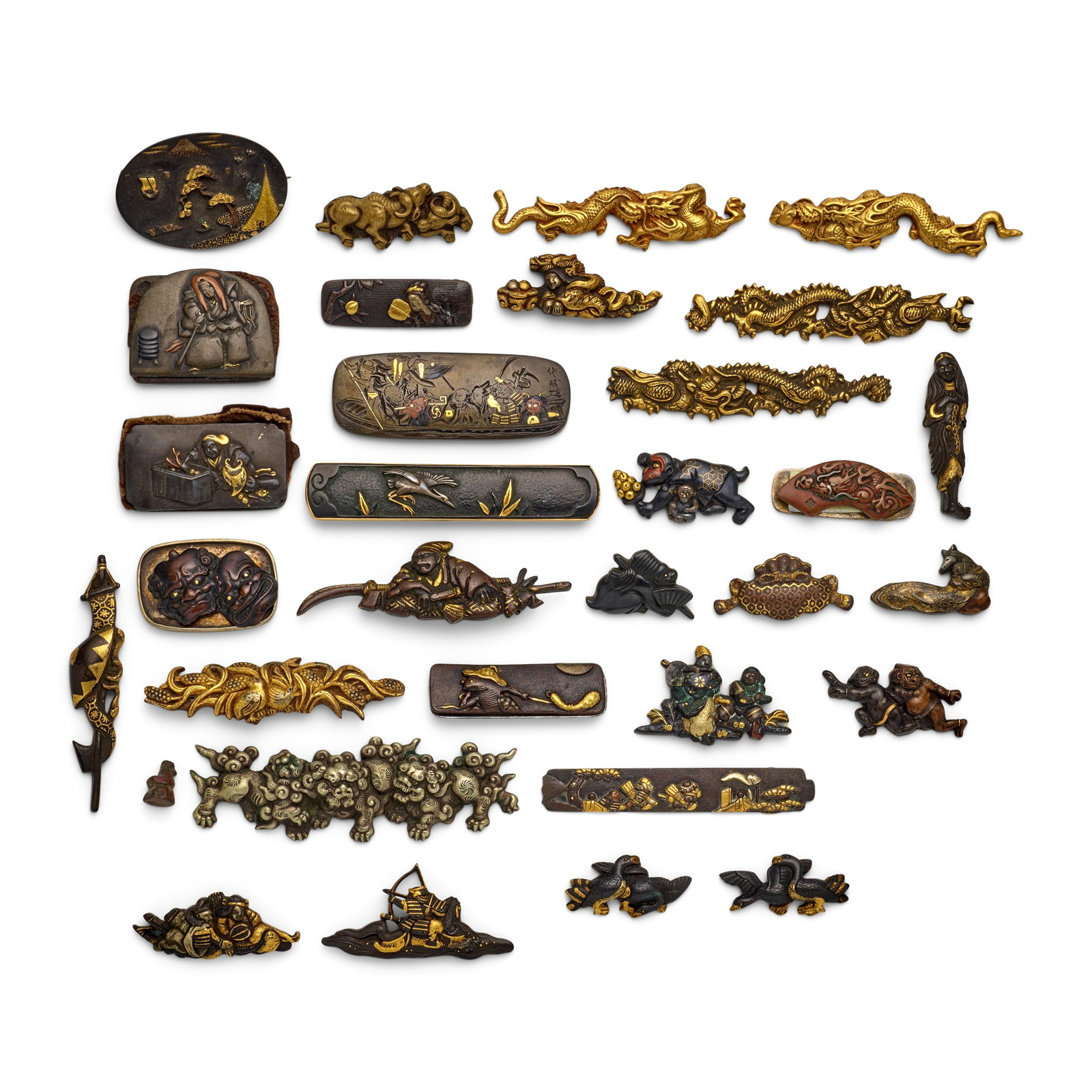 FOUR PAIRS OF MENUKI (HILT GRIPS), 14 SINGLE MENUKI, AND NINE KANAMONO (POUCH CLASPS) Edo period...: FOUR PAIRS OF MENUKI (HILT GRIPS), 14 SINGLE MENUKI, AND NINE KANAMONO (POUCH CLASPS) Edo period (1615-1868), 18th/19th century Comprising a shakudō nanako kozuka plate chiseled in relief and wit