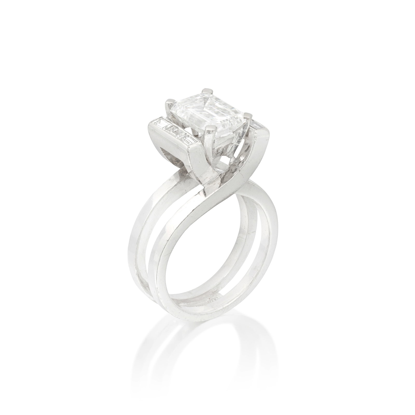 DIAMOND SINGLE-STONE RING: DIAMOND SINGLE-STONE RING The step-cut diamond weighing 2.59 carats, between obliquely-set shoulders, accented by baguette-cut diamonds, issuing from a crossover gallery and a bifurcated band, ring