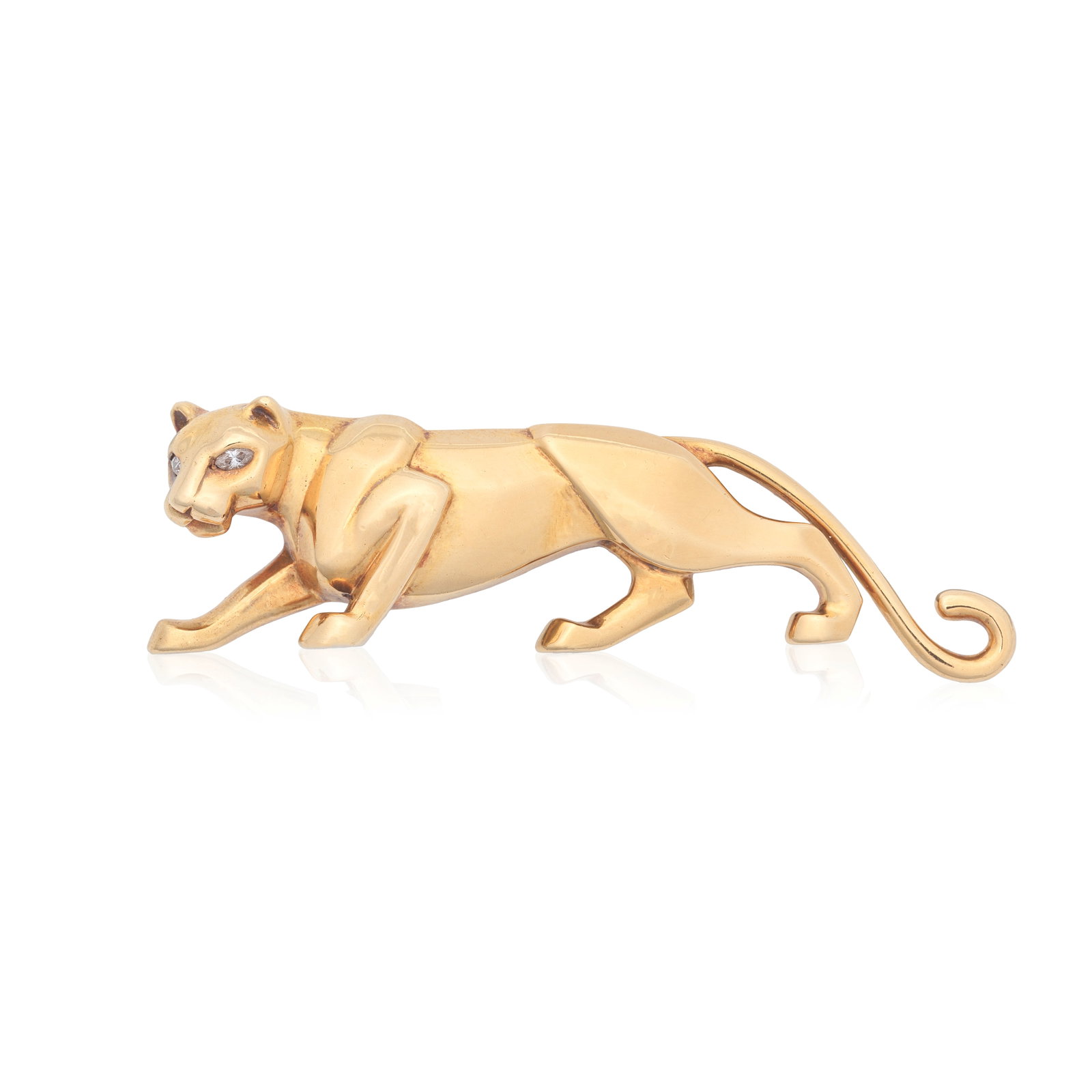 CARTIER: 'PANTHÈRE' BROOCH, 1986: CARTIER: 'PANTHÈRE' BROOCH, 1986 The prowling panther of 18 carat gold, set with brilliant-cut diamond eyes, signed Cartier London, numbered R6717, maker's mark JC, London hallmark, Convention