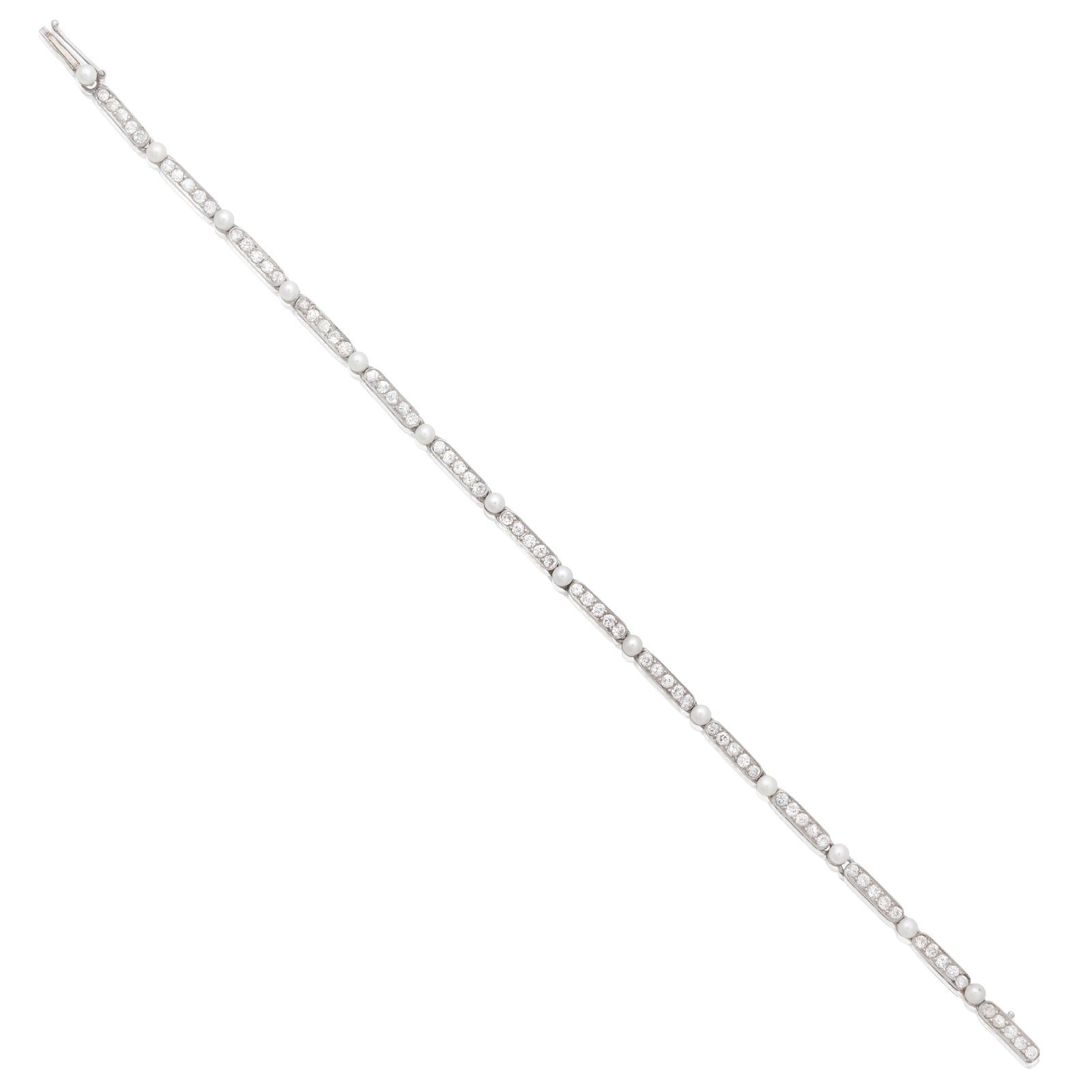 SEED PEARL AND DIAMOND LINE BRACELET, CIRCA 1915: SEED PEARL AND DIAMOND LINE BRACELET, CIRCA 1915 The old brilliant-cut diamond links spaced by seed pearls, mounted in platinum, diamonds approx. 1.20cts total, length 17.2cm Footnotes: A Private